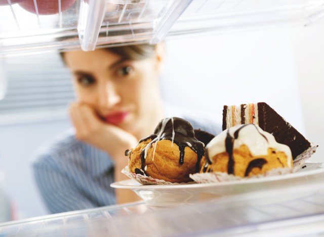 Woman craving junk food while on a diet