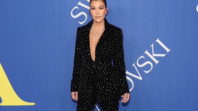 kourtney kardashian in black suit with white spots