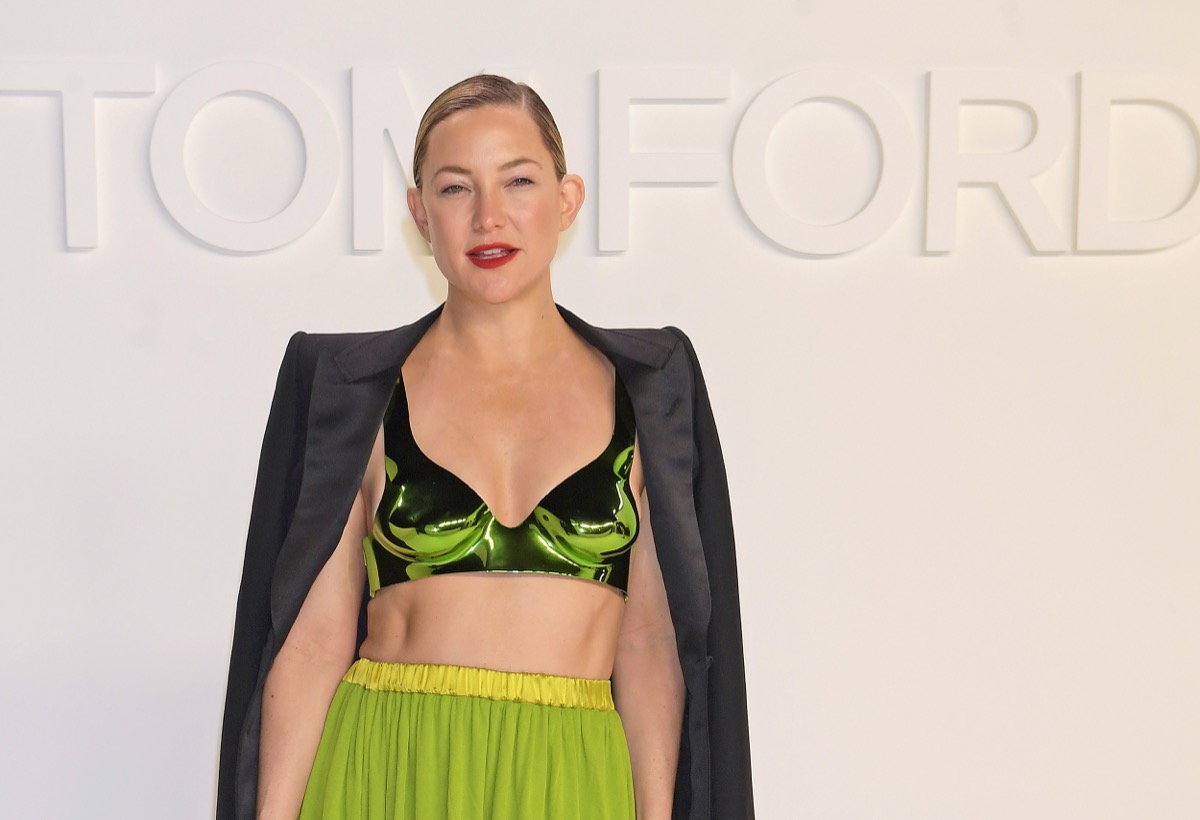 kate hudson in crop top and yellow skirt on runway