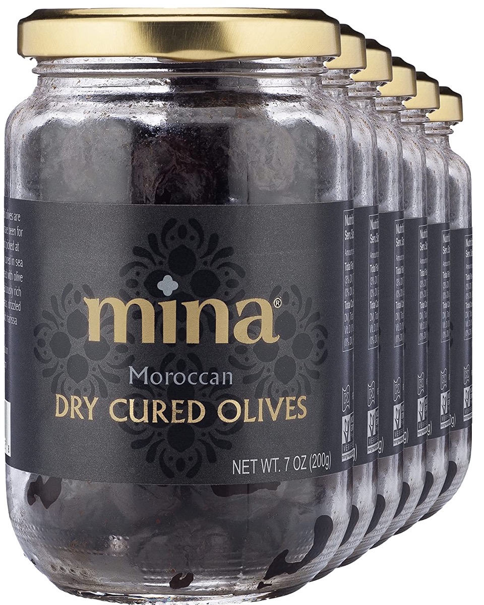multiple jars of mina moroccan dry cured olives on white background
