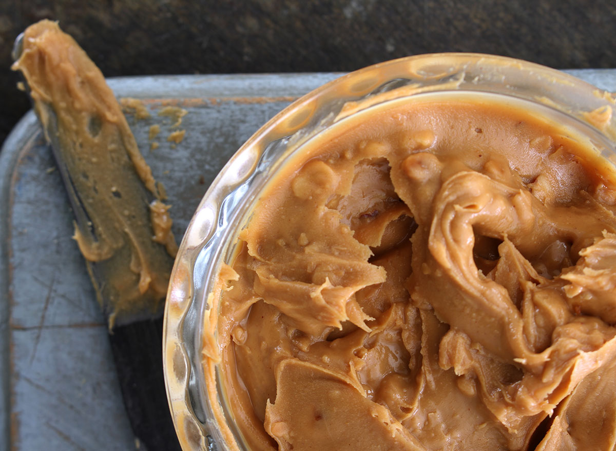 peanut butter spread in bowl with knife