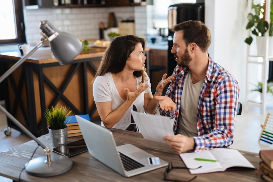 couple arguing at table non-negotiables in a relationship