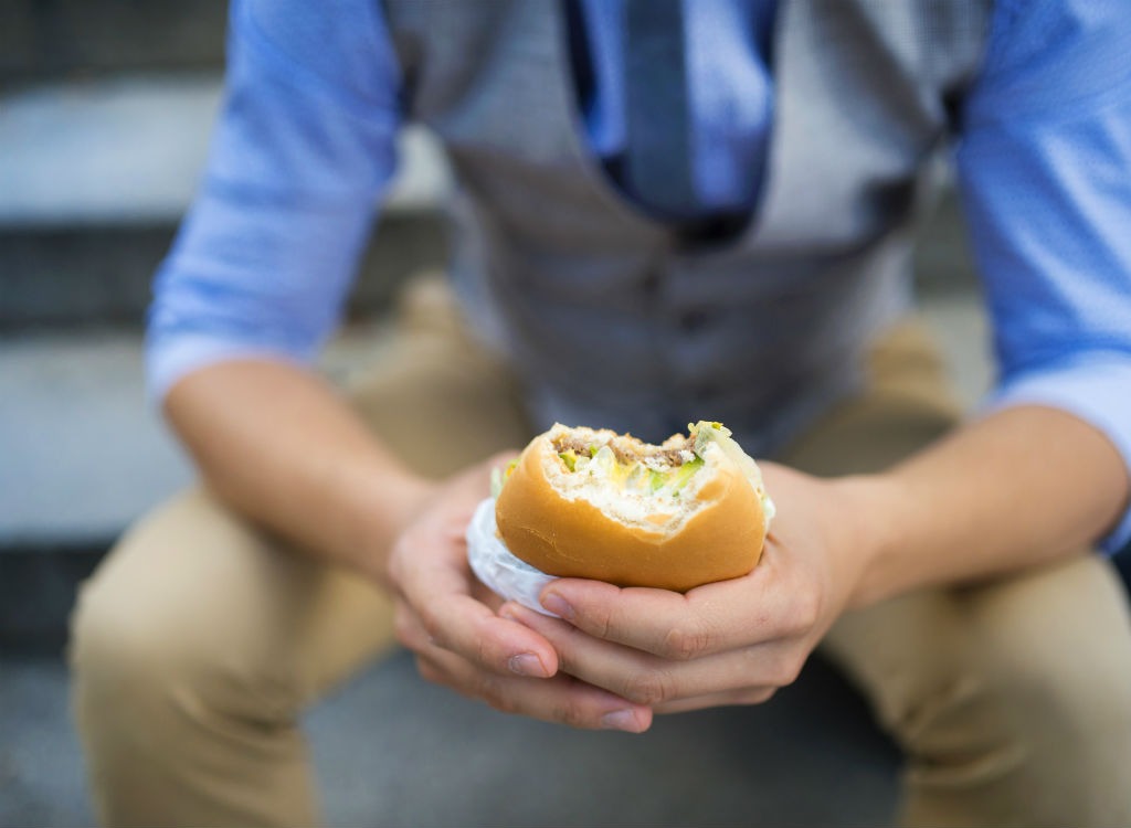 man eating a burger