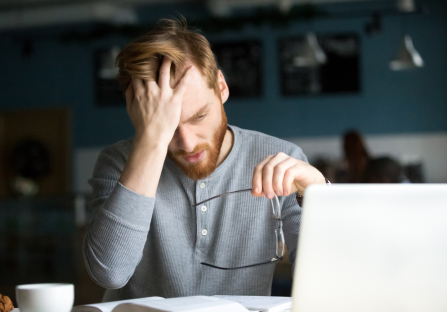 man holding his head triggers for empaths