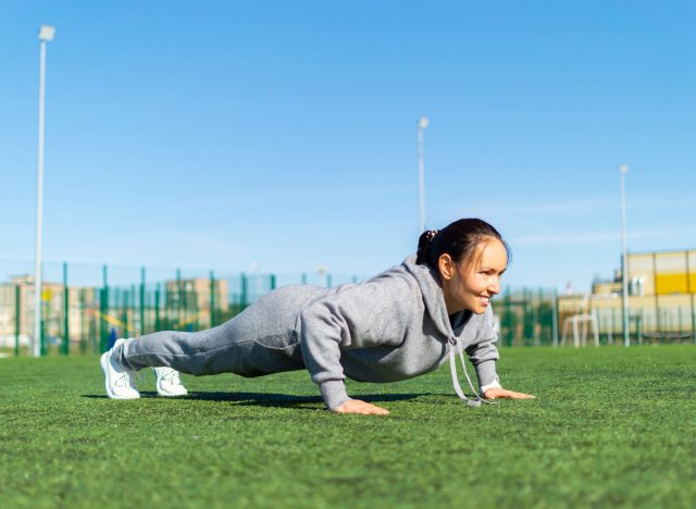 middle-aged woman doing pushups