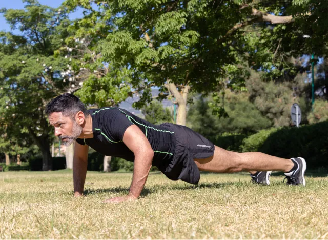 mature man doing pushups