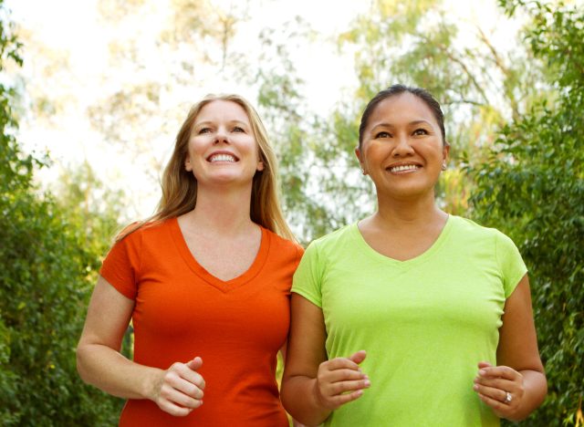 two friends brisk walking