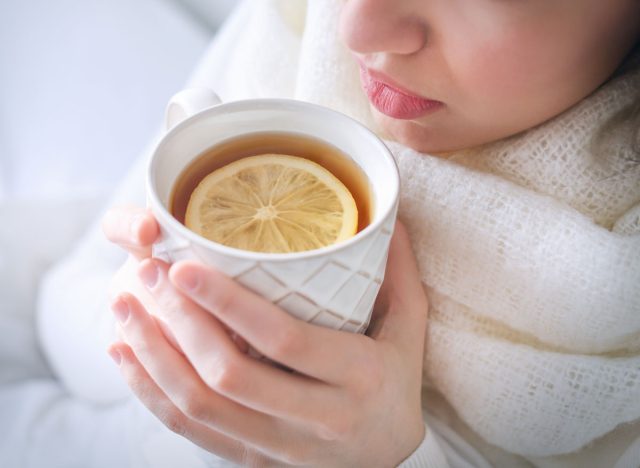 woman drinking tea and lemon, concept of lazy ways to lose weight
