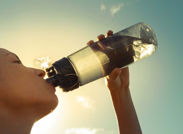 Drinking out of large water bottle