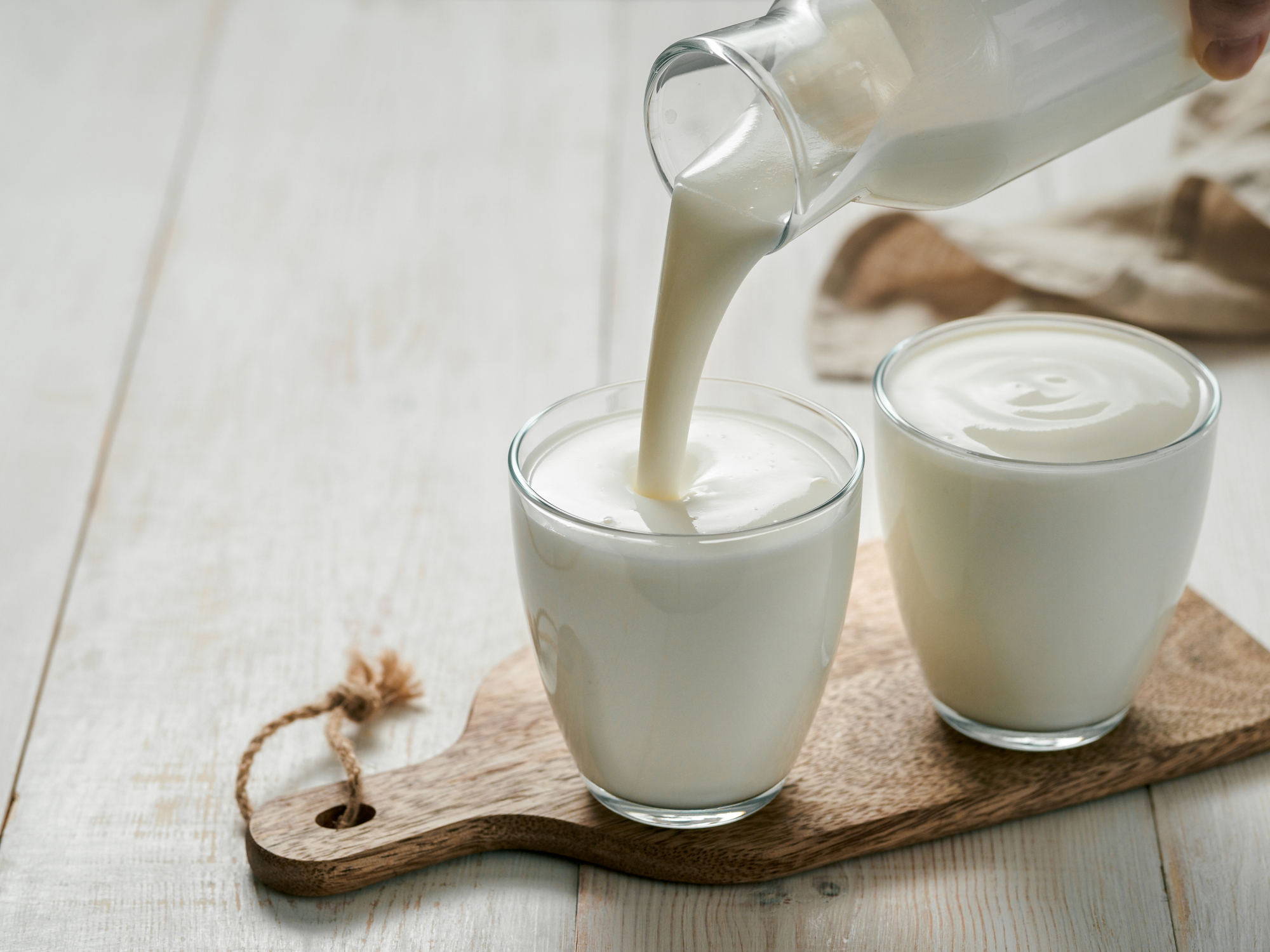 Cups being poured of kefir | Sour Cream Substitutes