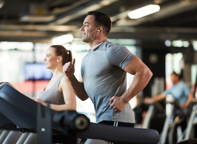 mature muscular man on the treadmill, demonstrating cardio workouts to increase stamina