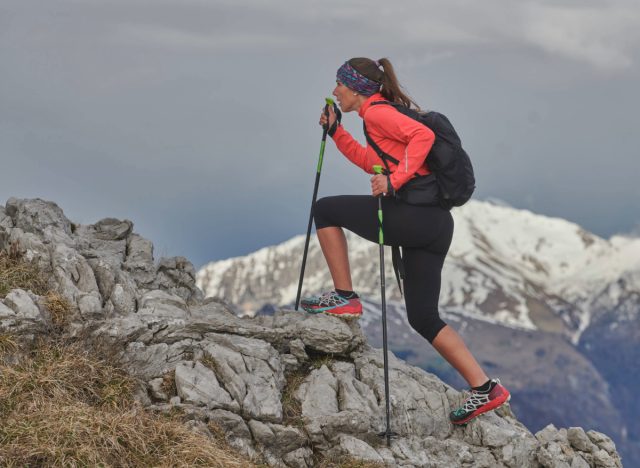 woman on uphill hike in mountains