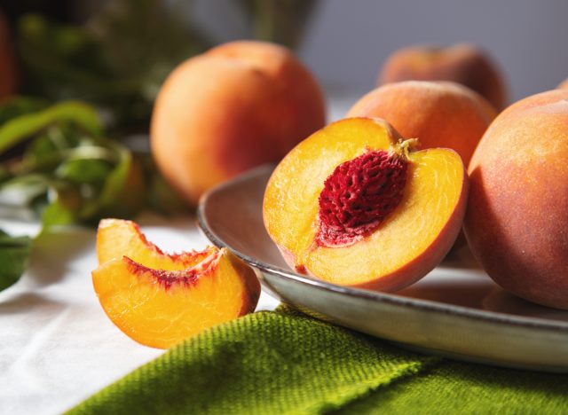 peaches sliced on table