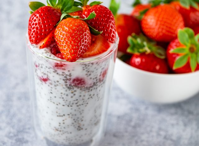 Close up chia pudding with berries, strawsberry, raspberries on the rustic background