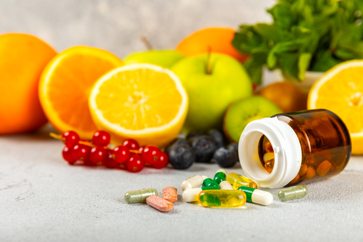 Variety of Supplements in front of Fruits | is it bad to eat the same thing every day