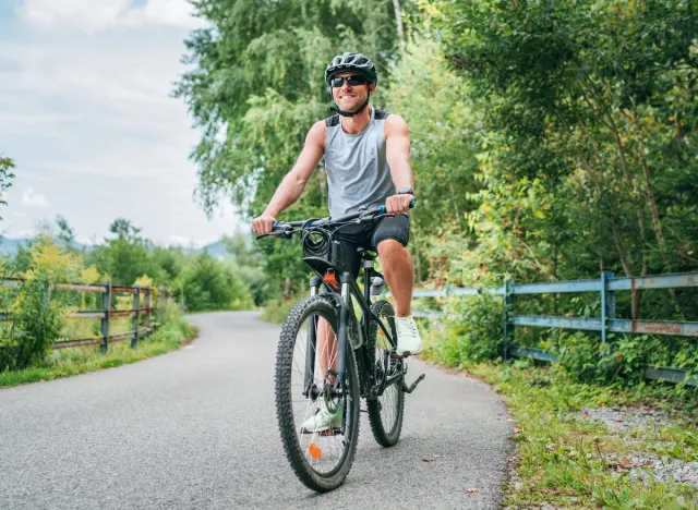 man bike riding, concept of best ways to burn 100 calories