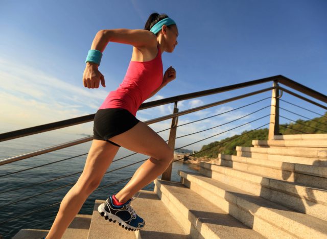 woman doing stair sprints outdoors, concept of high-intensity cardio exercises for weight loss