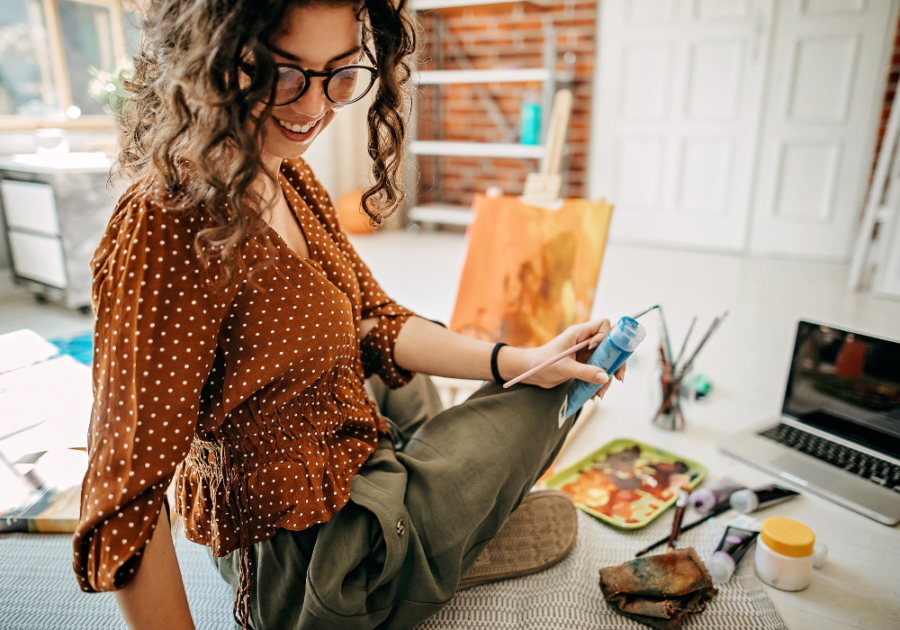 young woman painting hobbies for women in their 20s