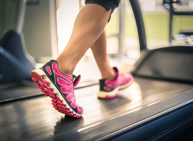 woman walking on a treadmill, concept of how fast to walk on treadmill for weight loss