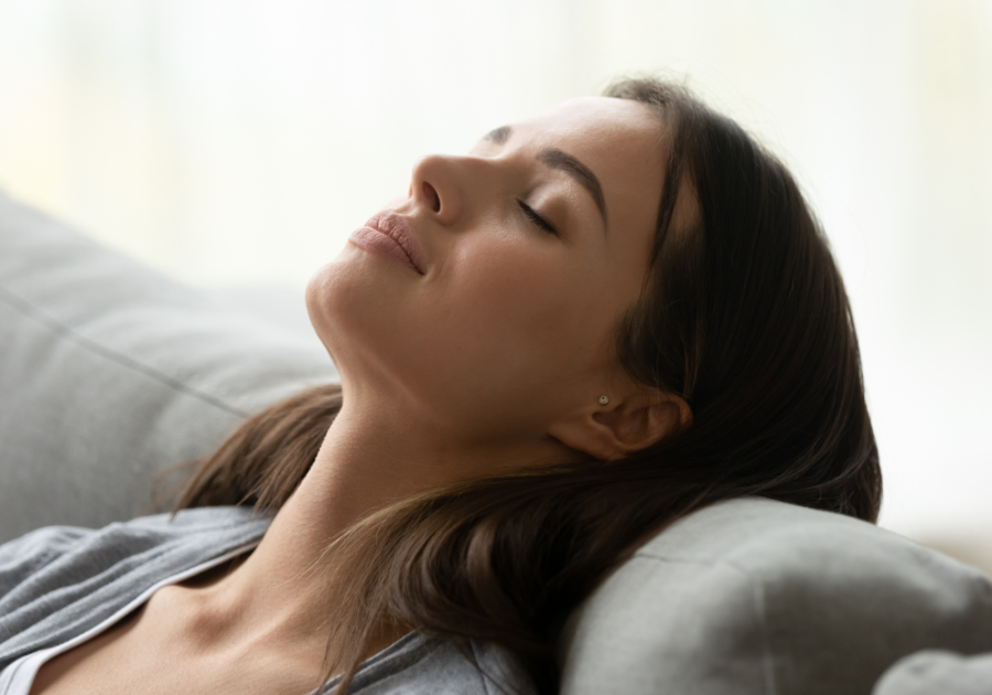 woman doing deep breathing how to calm your anger