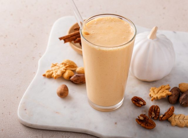 pumpkin smoothie on board with pumpkin, nuts, and cinnamon, healthy smoothies for weight loss