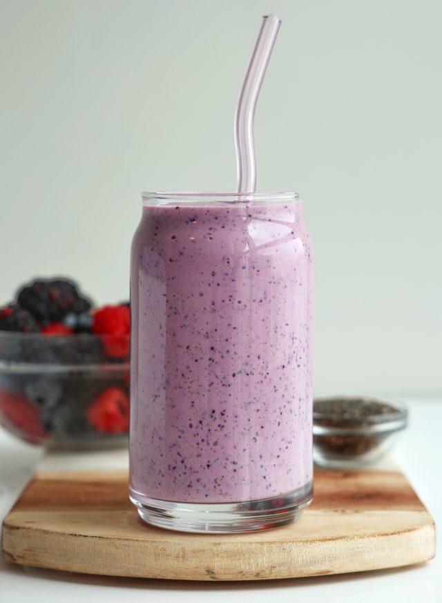 high protein triple berry smoothie in a glass close-up