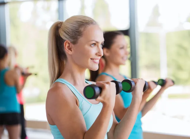 woman performing bicep curl to get rid of flabby arms