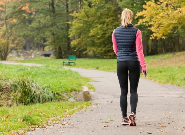 fitness woman walking on trail