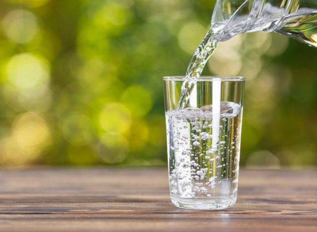 pouring water into glass