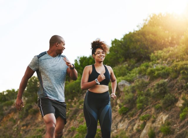 couple walking outdoors for exercise, concept of how to lose one pound a week by walking