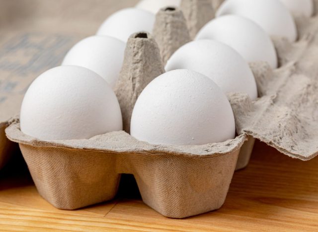 Eggs in carton on table