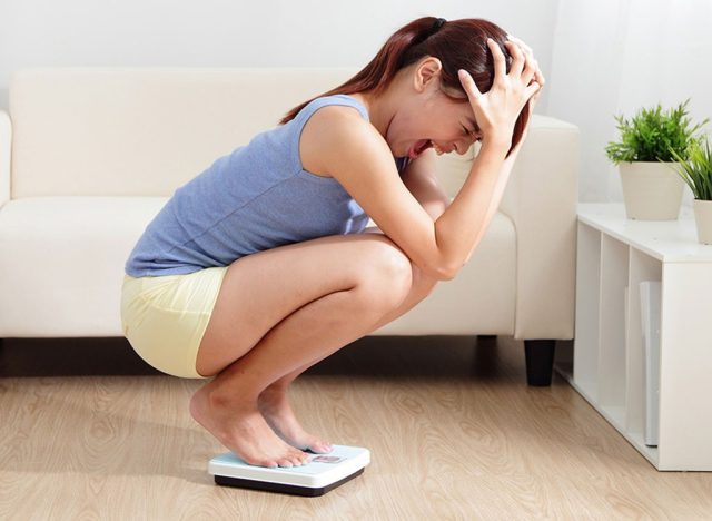 Woman frustrated on scale